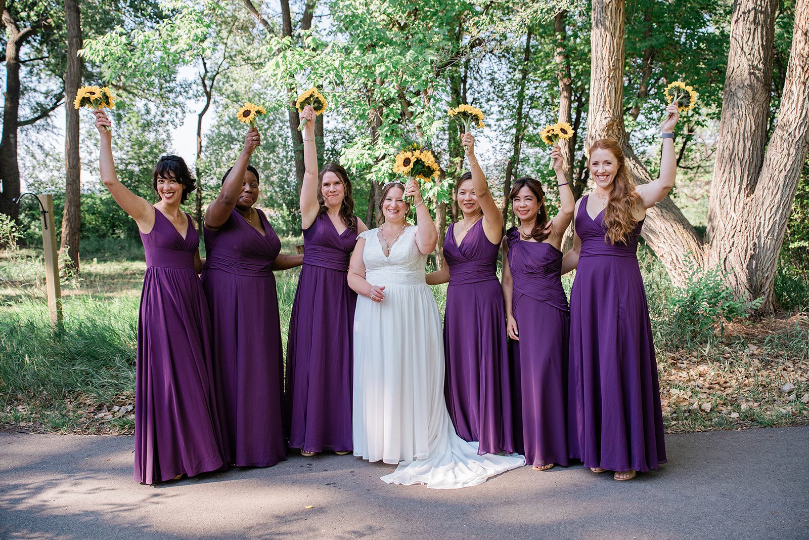 chatfield-farms-airy-denver-june-logan-008-08 Bridesmaids cheering with their bouquets