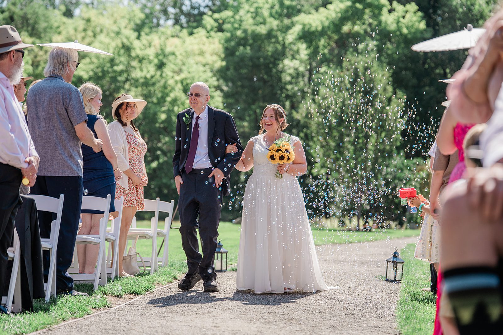 chatfield-farms-airy-denver-june-logan-010-05 Bride walking down the aisle at Chatfield Farms
