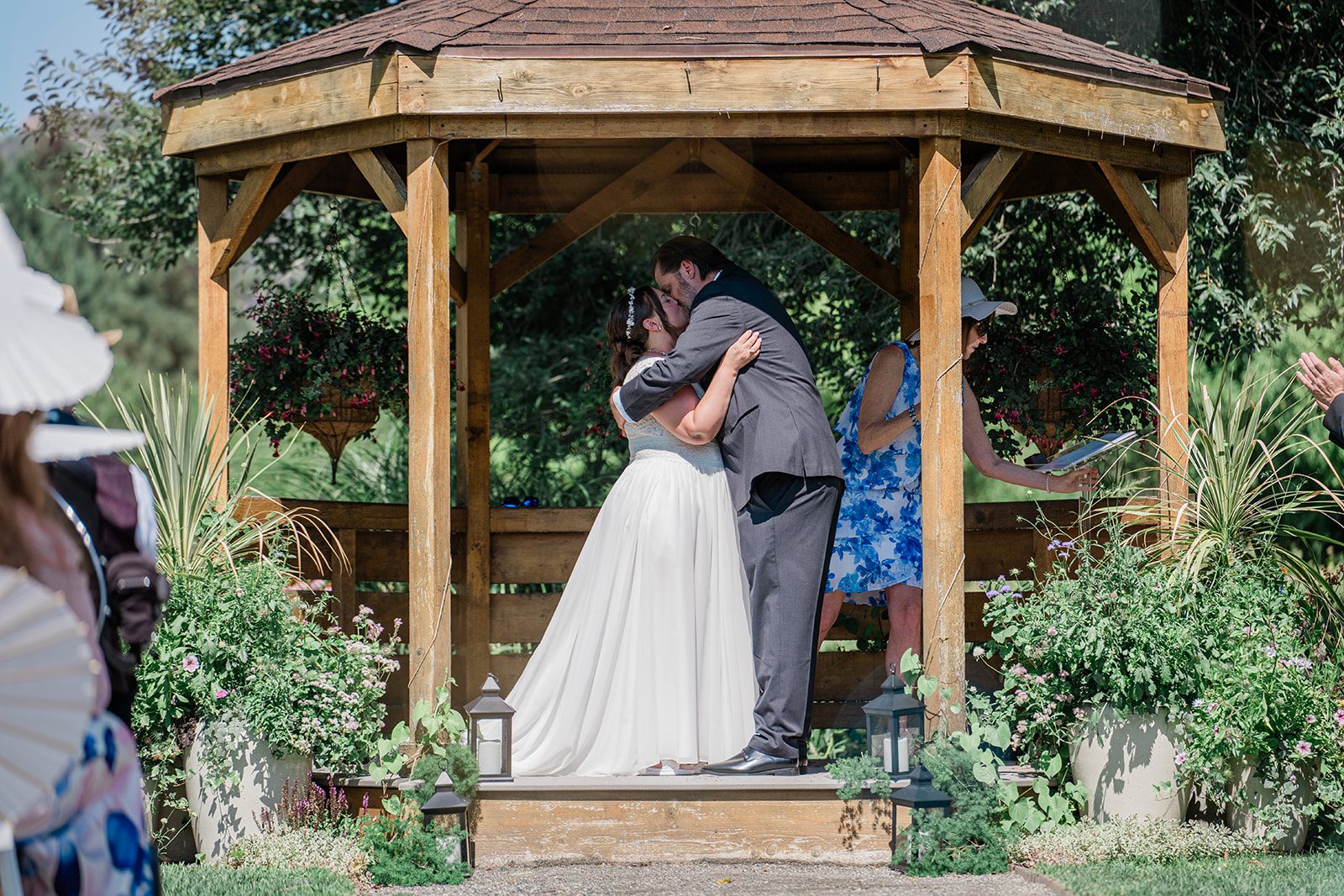 chatfield-farms-airy-denver-june-logan-012-22 First kiss under the gazebo at Chatfield Farms