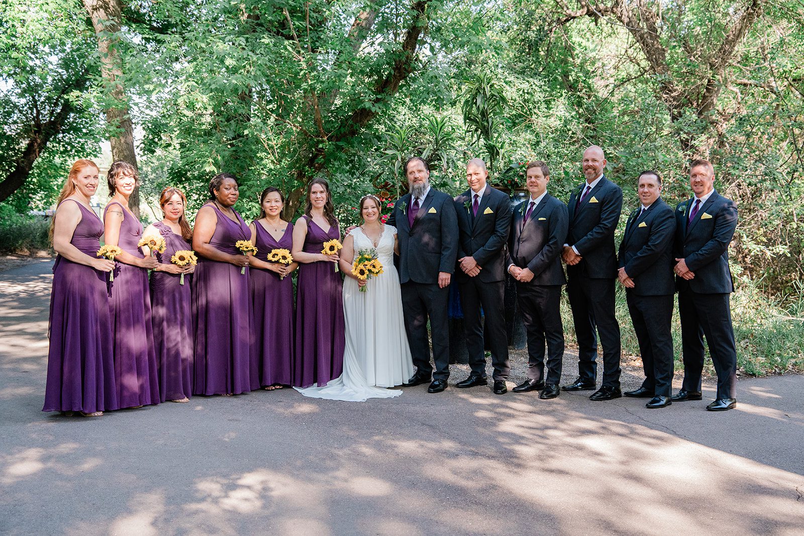 chatfield-farms-airy-denver-june-logan-023-13 Wedding party lined up in the garden at Chatfield Farms