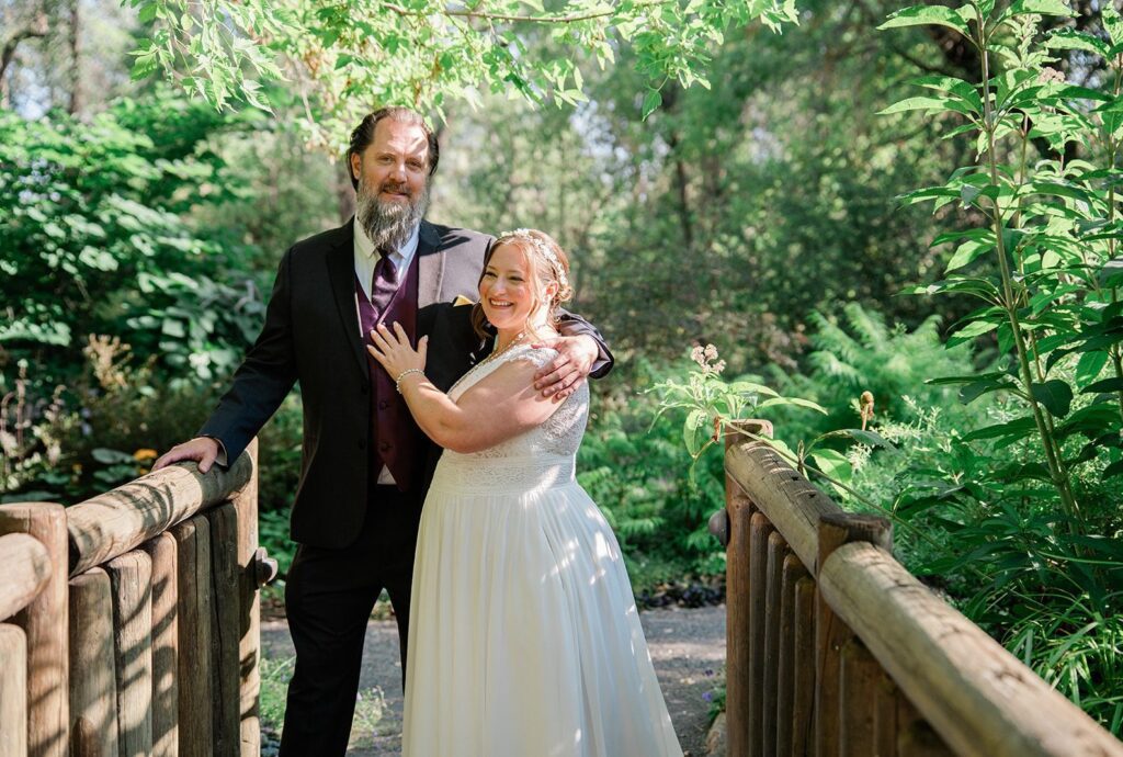 Denver Wedding Photographers at Chatfield Farms | June & Logan 8 Bride and groom on the wooden bridge, captured by Denver wedding photographers from Original Weddings at Chatfield Farms