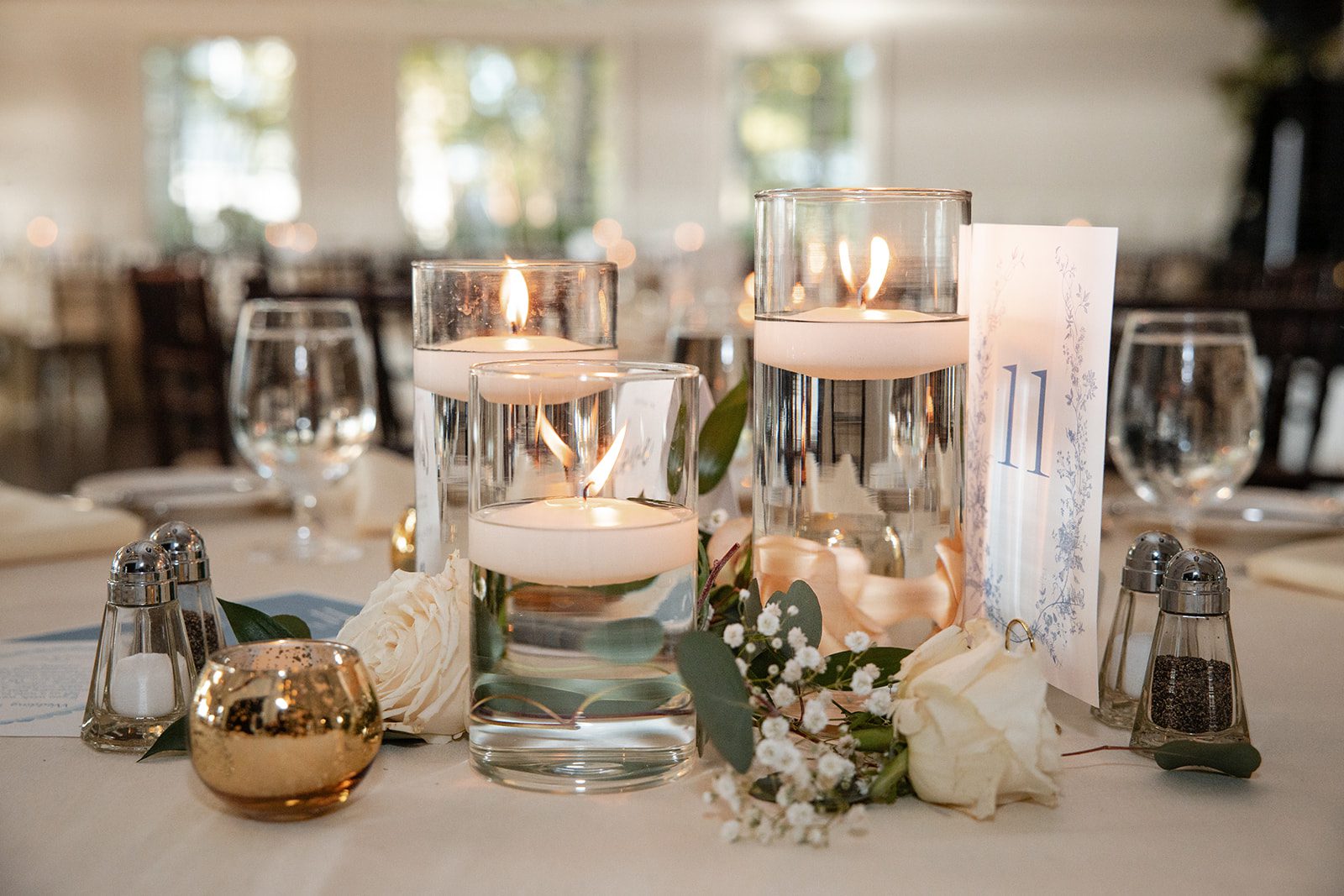 chesapeake-bay-beach-club-timeless-baltimore-kelsey-tom-004-33 Table centerpiece with candles and greenery