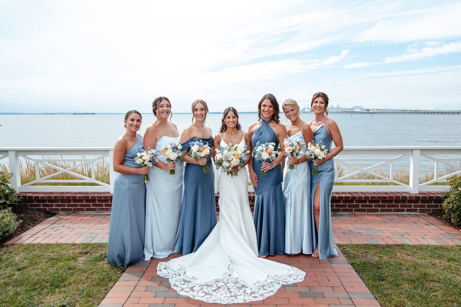 chesapeake-bay-beach-club-timeless-baltimore-kelsey-tom-012-45 Bride with her bridesmaids by the water at Chesapeake Bay Beach Club