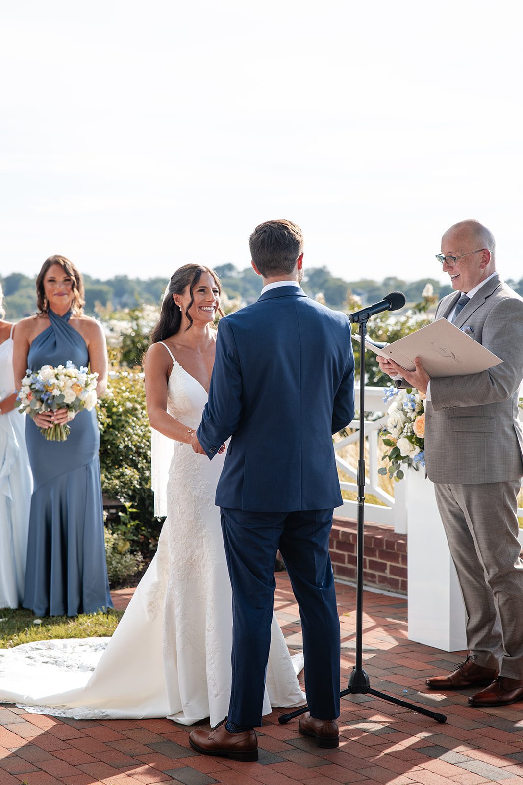 chesapeake-bay-beach-club-timeless-baltimore-kelsey-tom-021-56 Couple smiling during the ceremony