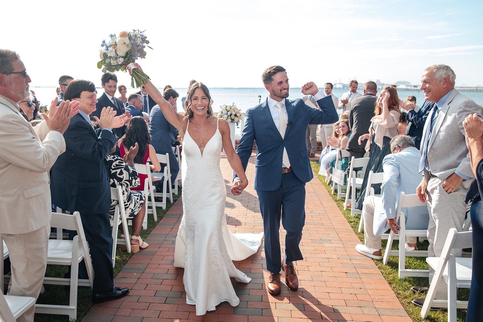 chesapeake-bay-beach-club-timeless-baltimore-kelsey-tom-024-20 Newlyweds walking back up the aisle