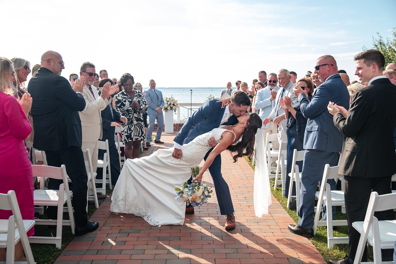 chesapeake-bay-beach-club-timeless-baltimore-kelsey-tom-025-04 Groom dipping the bride after the ceremony