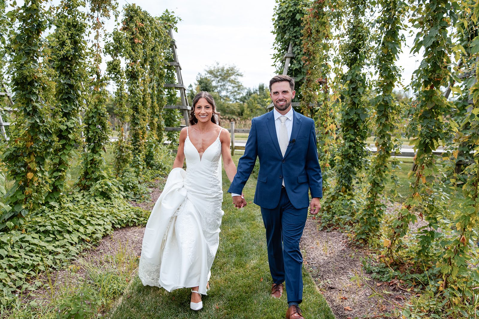 chesapeake-bay-beach-club-timeless-baltimore-kelsey-tom-027-42 Bride and groom on the garden path