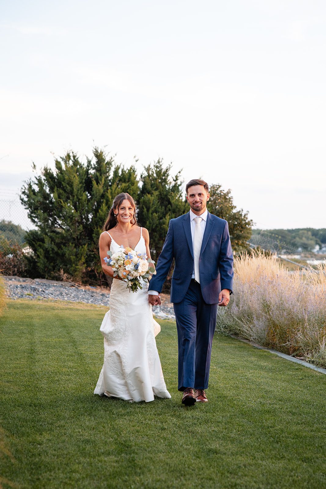 chesapeake-bay-beach-club-timeless-baltimore-kelsey-tom-038-36 Bride and groom on the lawn at dusk