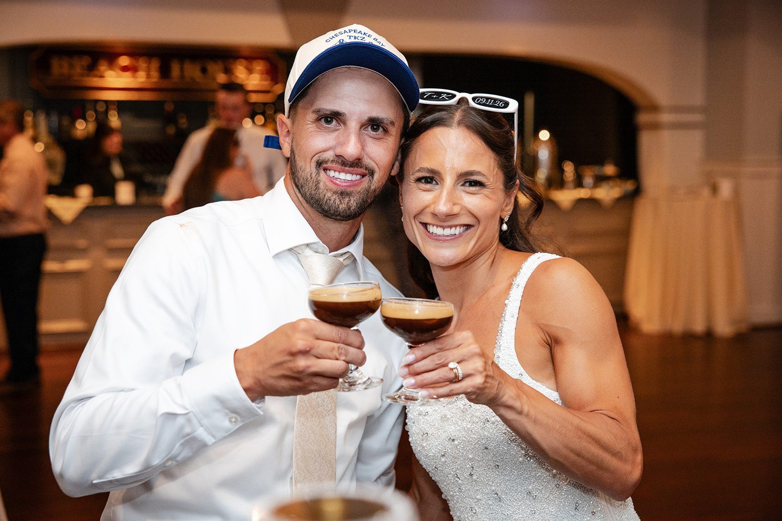 chesapeake-bay-beach-club-timeless-baltimore-kelsey-tom-045-49 Bride and groom raising a toast