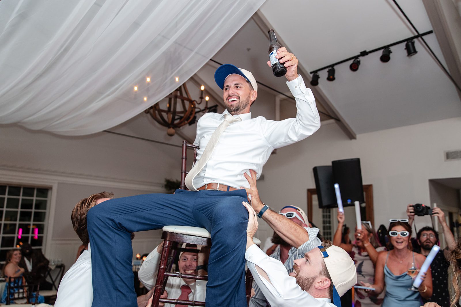 chesapeake-bay-beach-club-timeless-baltimore-kelsey-tom-056-17 Groom lifted up by his friends