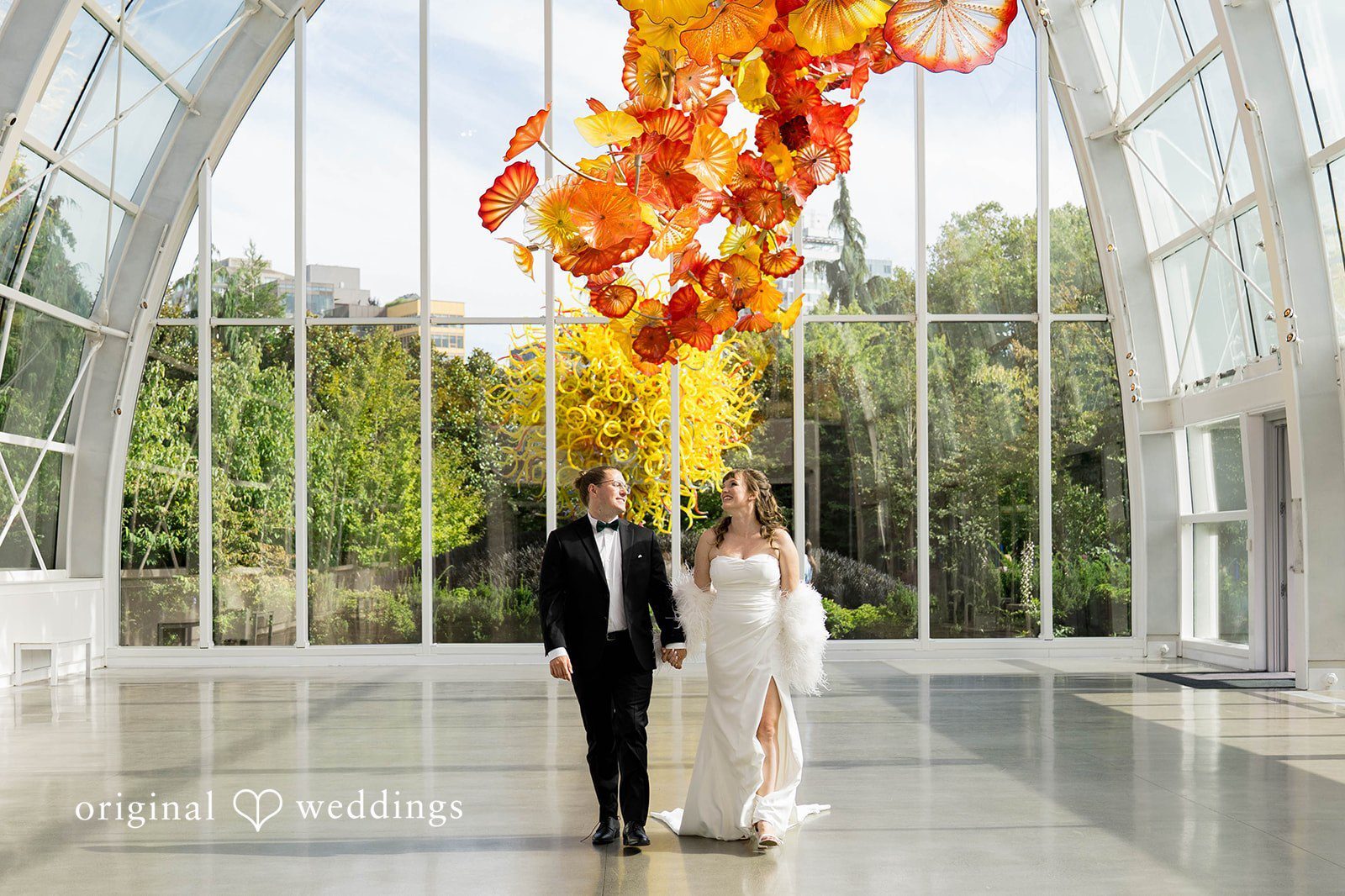 Our Seattle wedding photographers at Original Weddings captured a stunning portrait of the couple at Chihuly Garden and Glass
