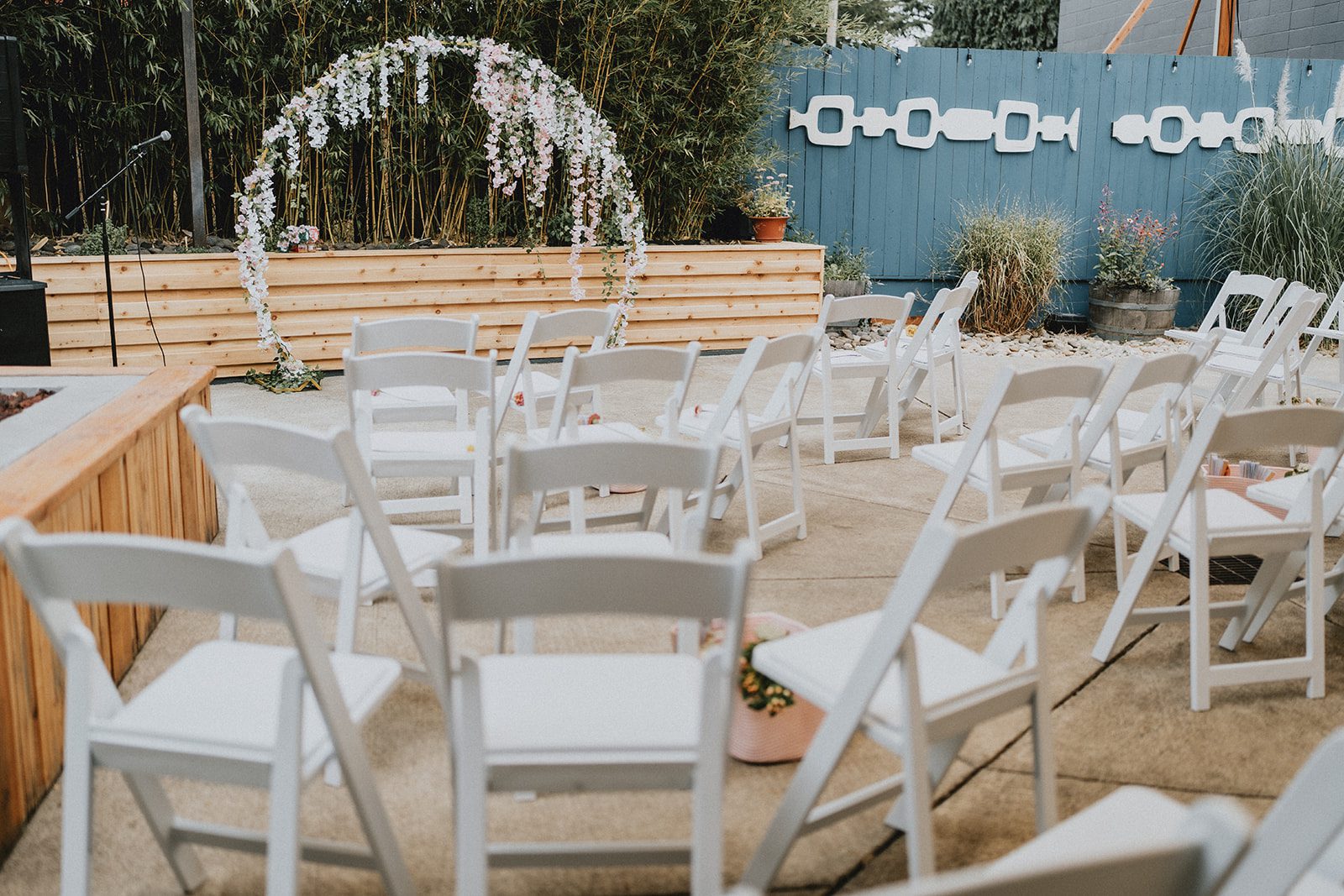 Outdoor ceremony seating and floral arch at Chill Chill Chill