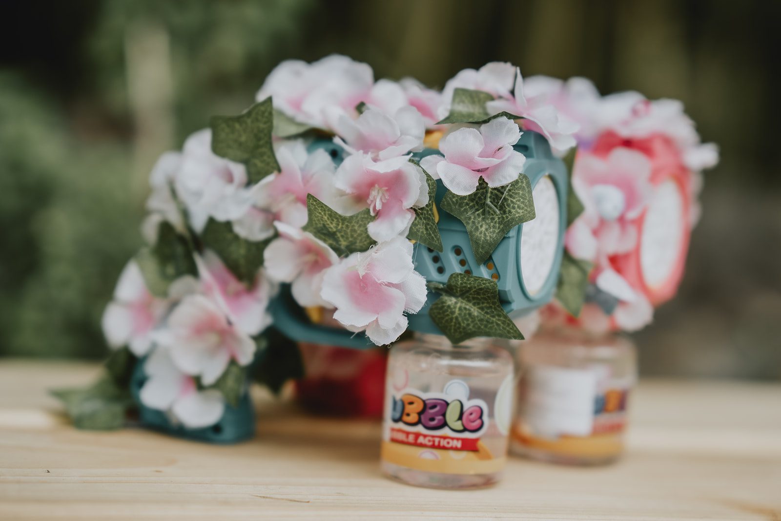 Pink and white flowers in glass jars