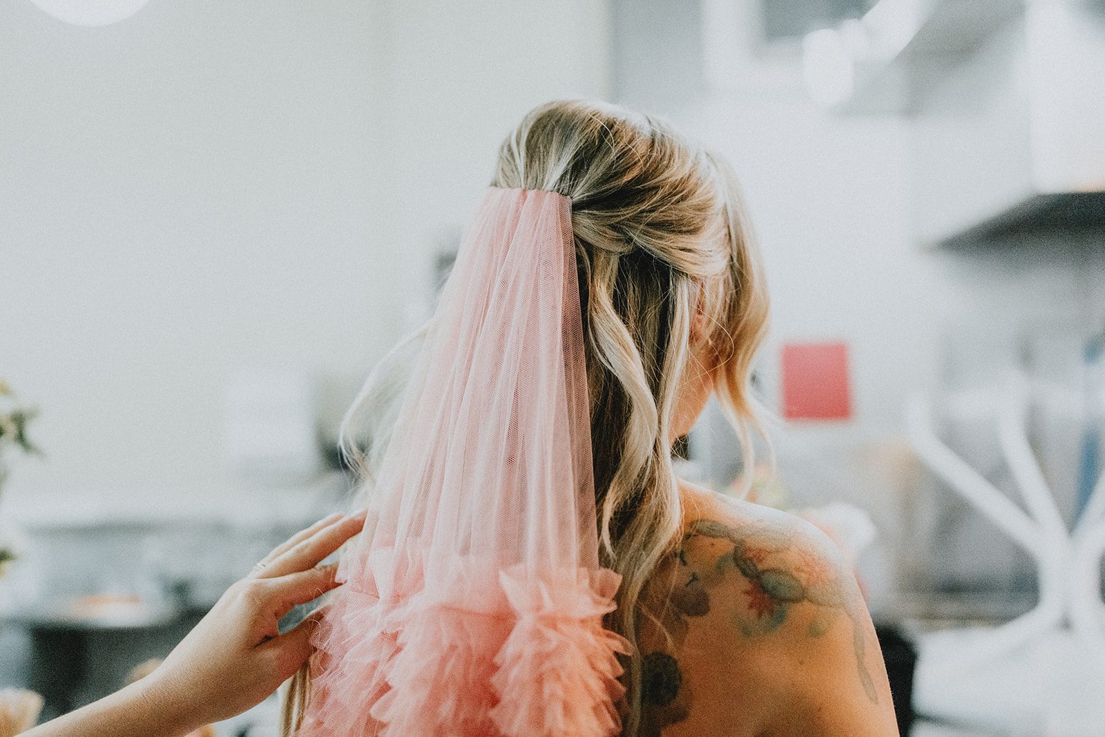 Close up of the bride's pink tulle veil