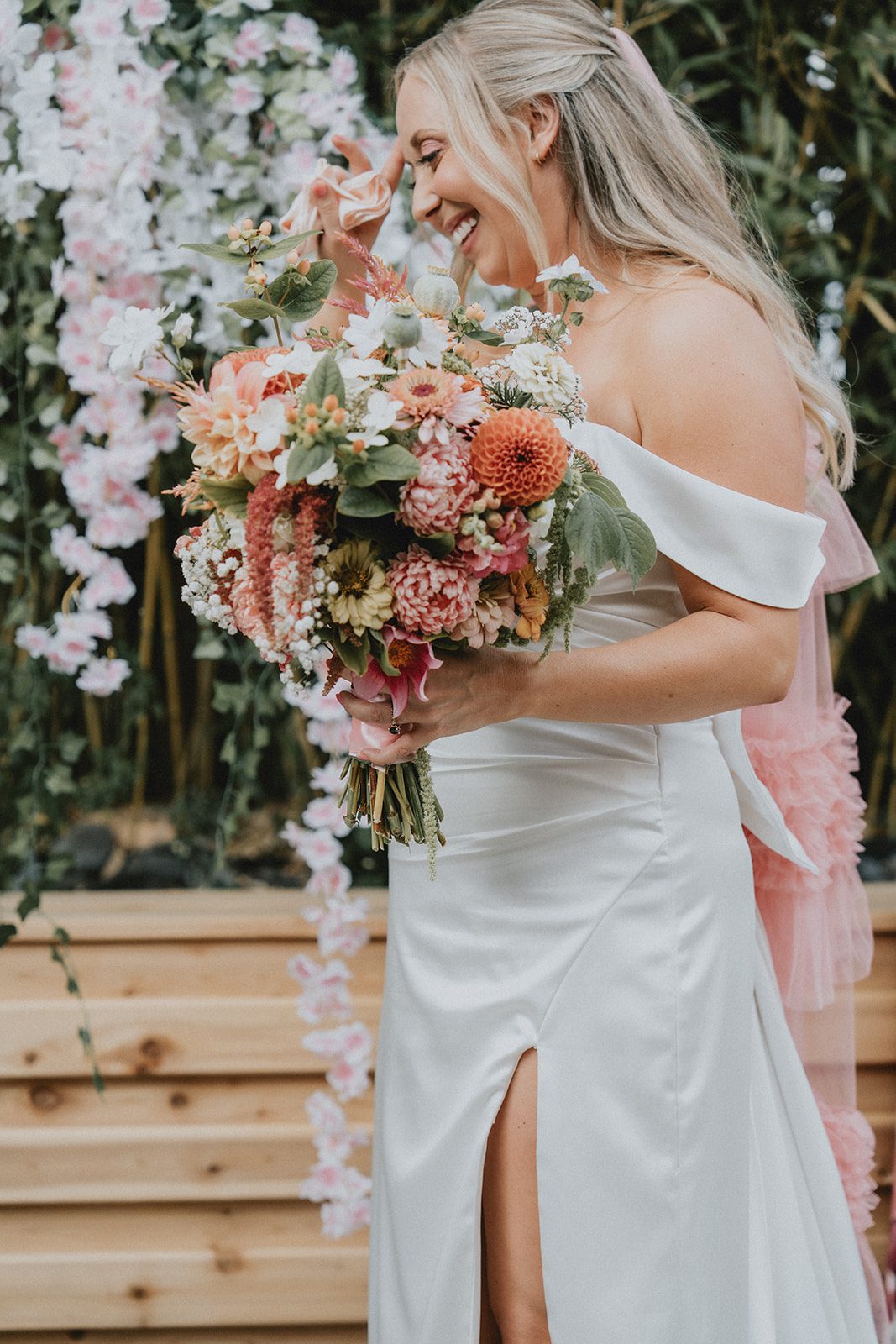Bride holding a colorful bouquet