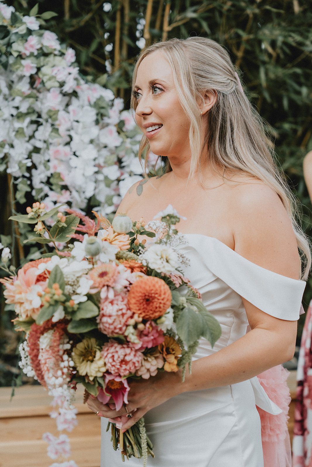 Bride smiling with her bouquet at Chill Chill Chill