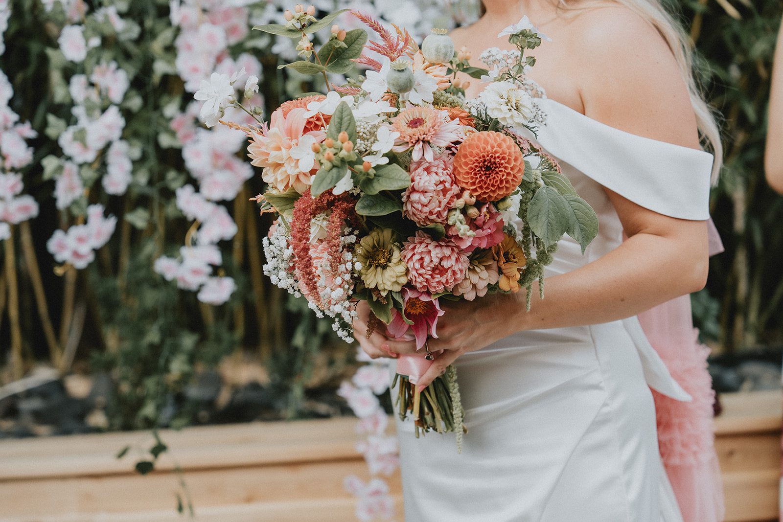 Bridal bouquet with peach and pink blooms