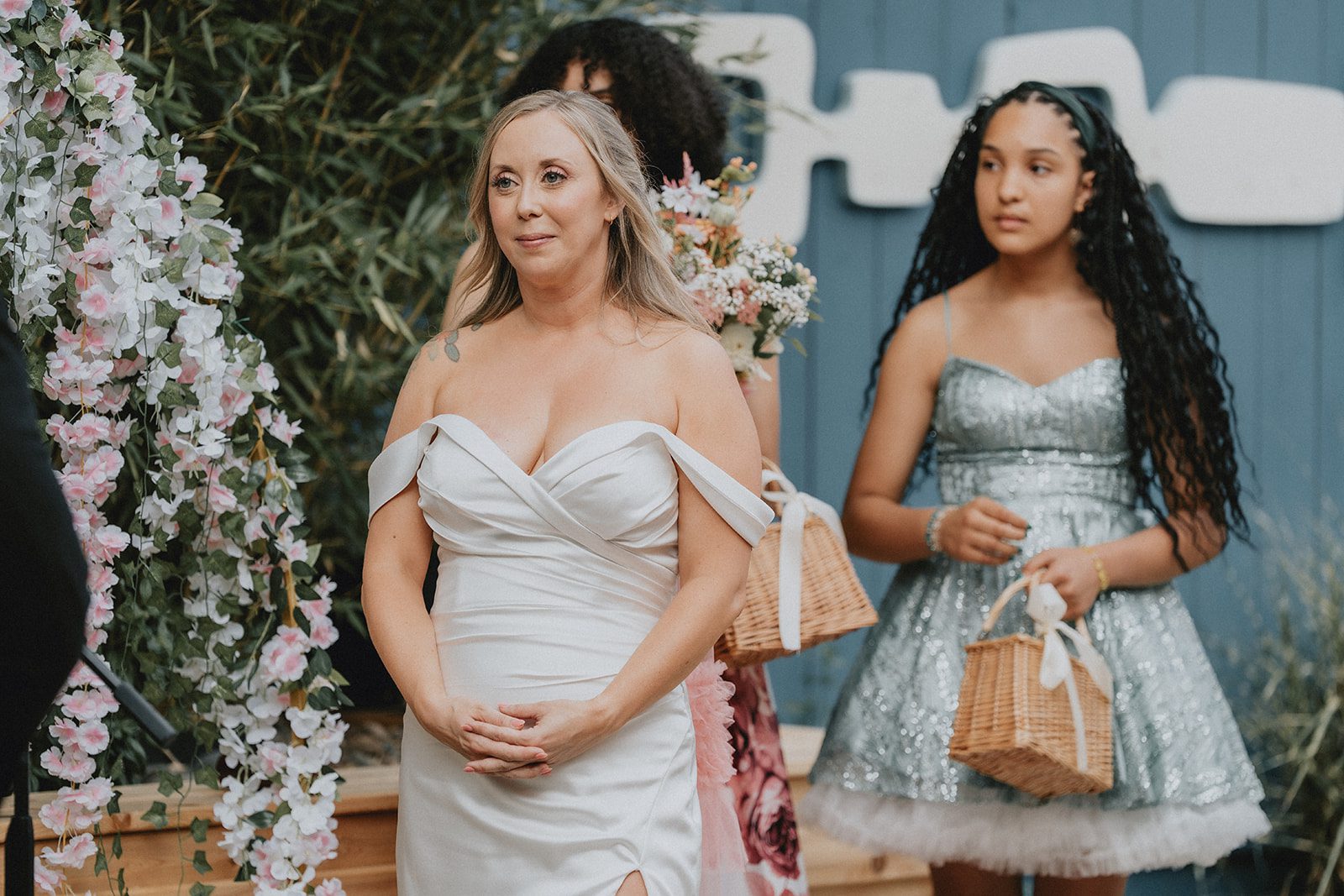 Bride with a young guest in a blue dress