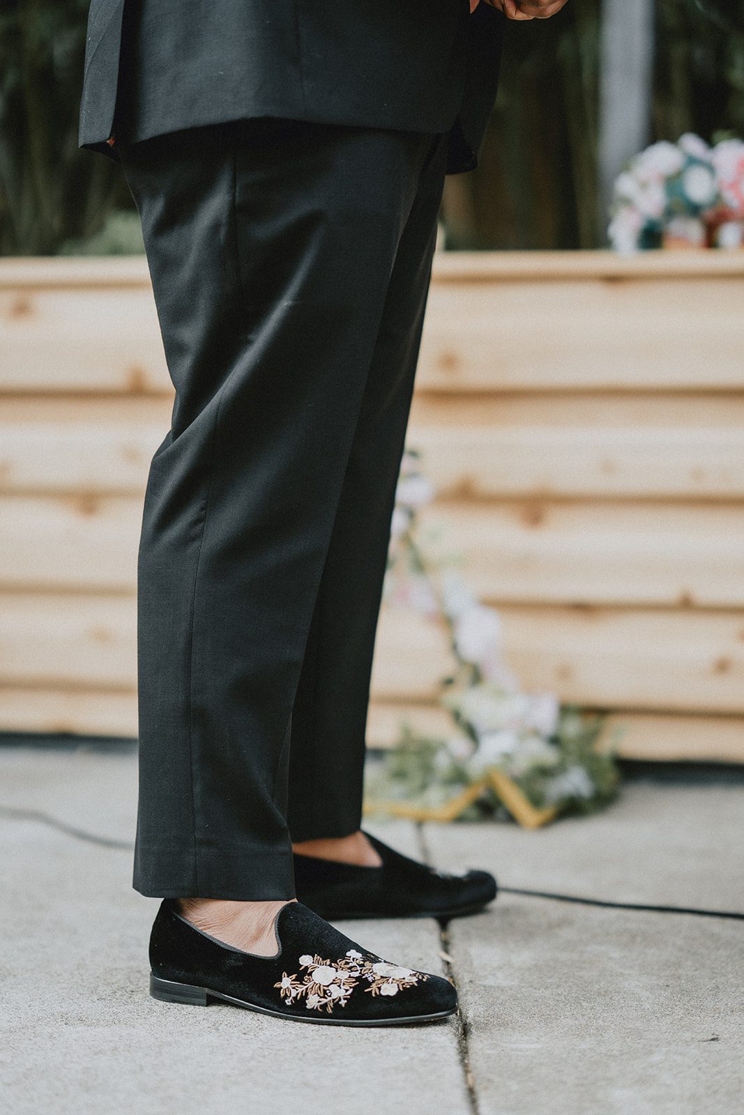 Groom's shoes on the wooden deck