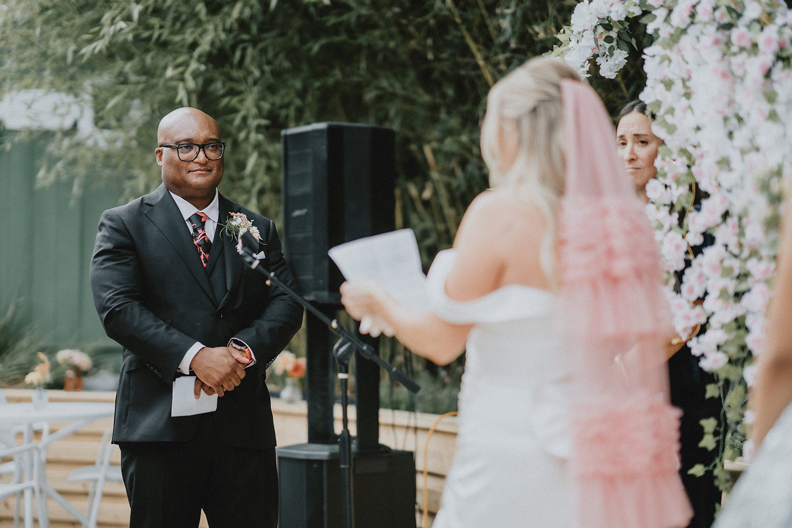 Bride and groom facing each other at the ceremony at Chill Chill Chill