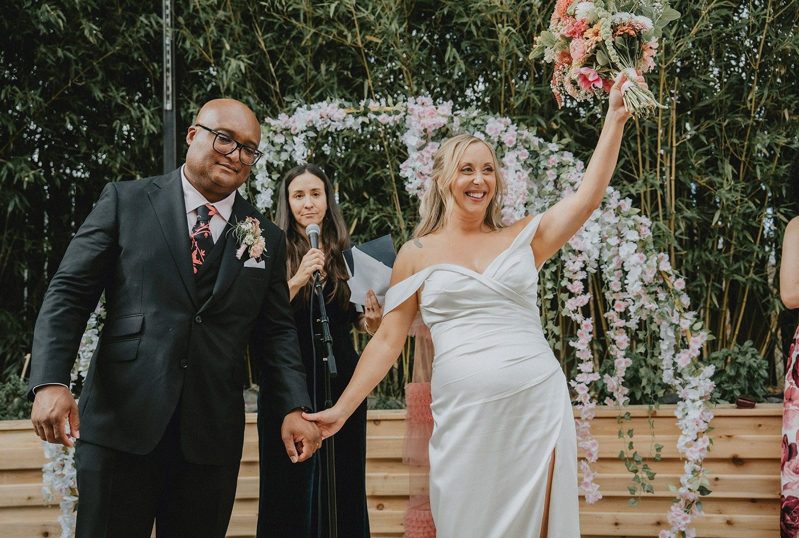 Newlyweds celebrating with arms raised, captured by Portland wedding photographers from Original Weddings at Chill Chill Chill
