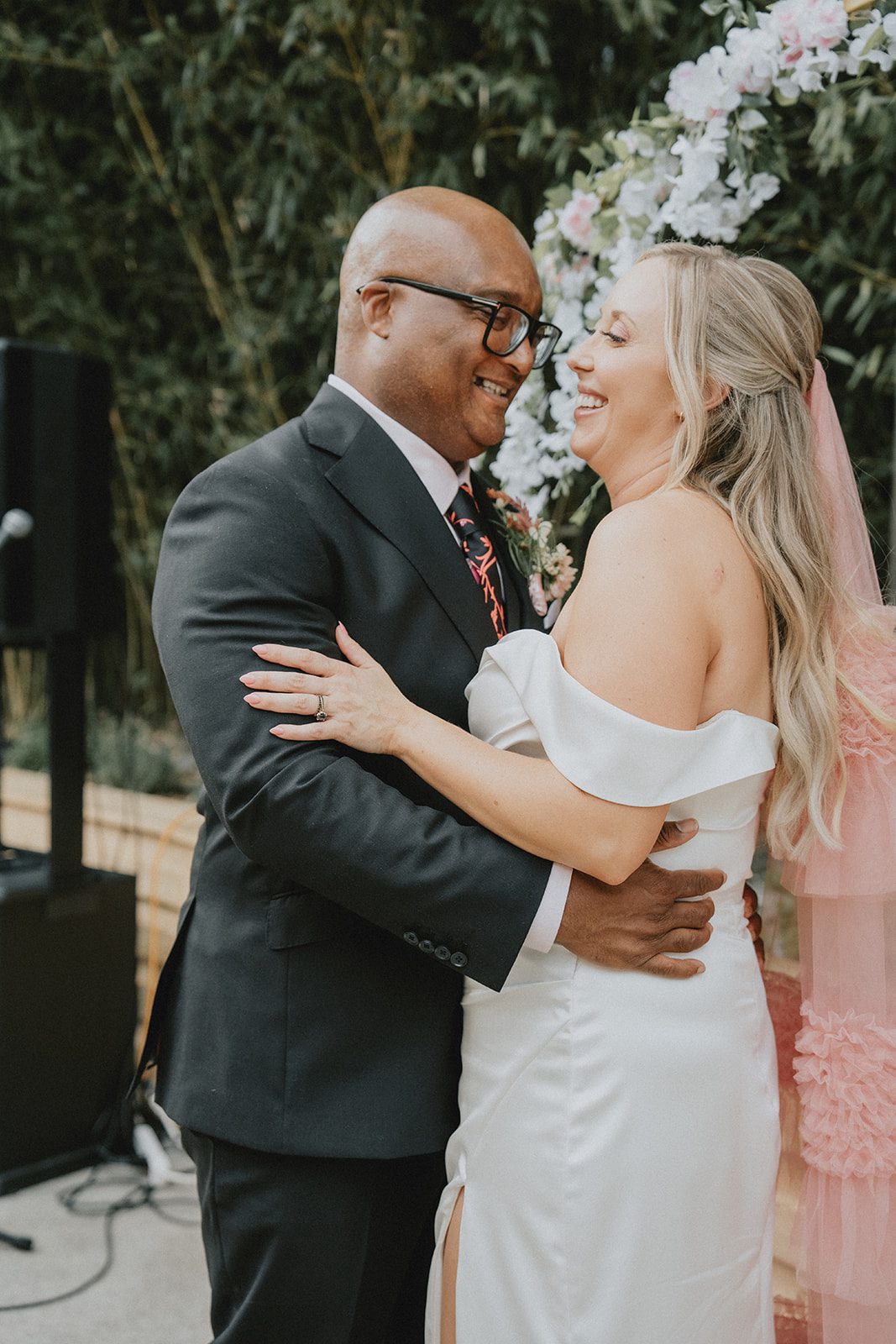 Groom holding the bride close