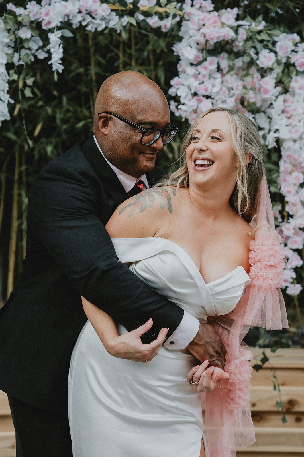 Couple smiling together in front of the flowers at Chill Chill Chill