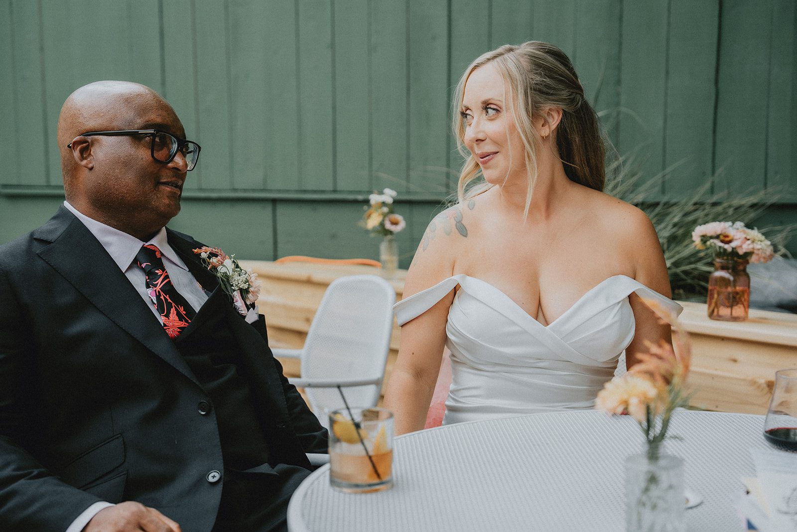 Newlyweds sitting together at their table