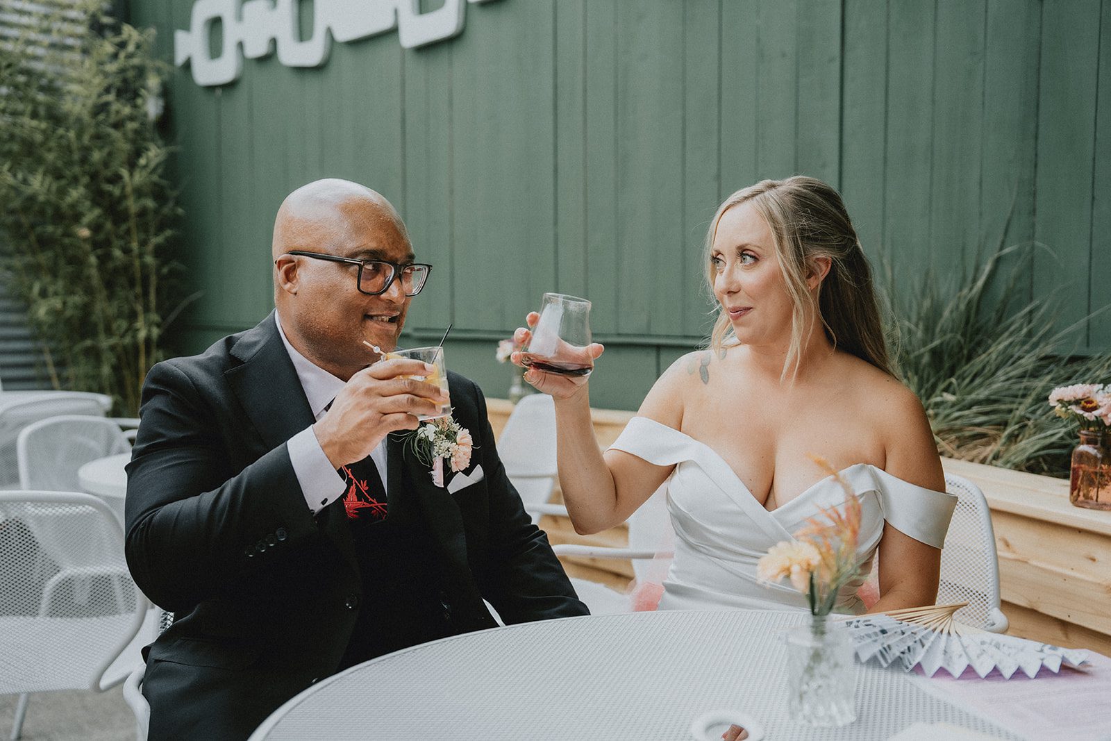 Couple raising a toast at the reception