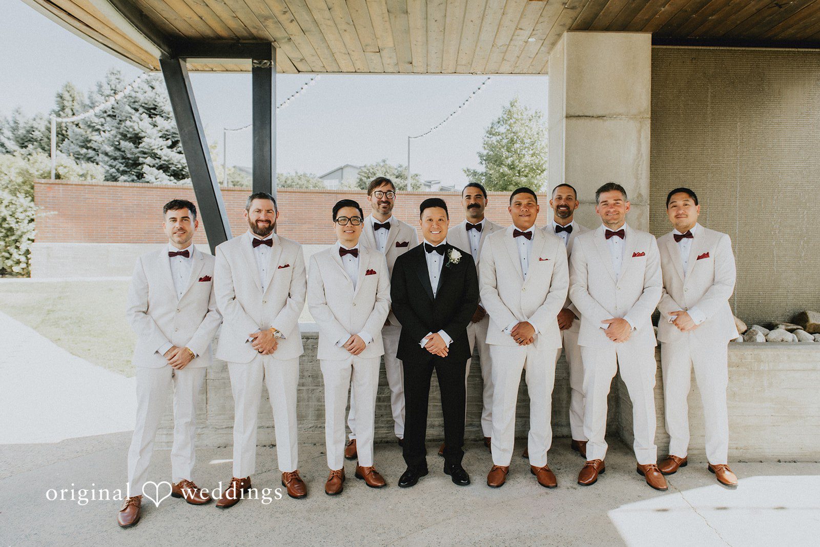 Sonia + Michael Groom and groomsmen lined up in light suits