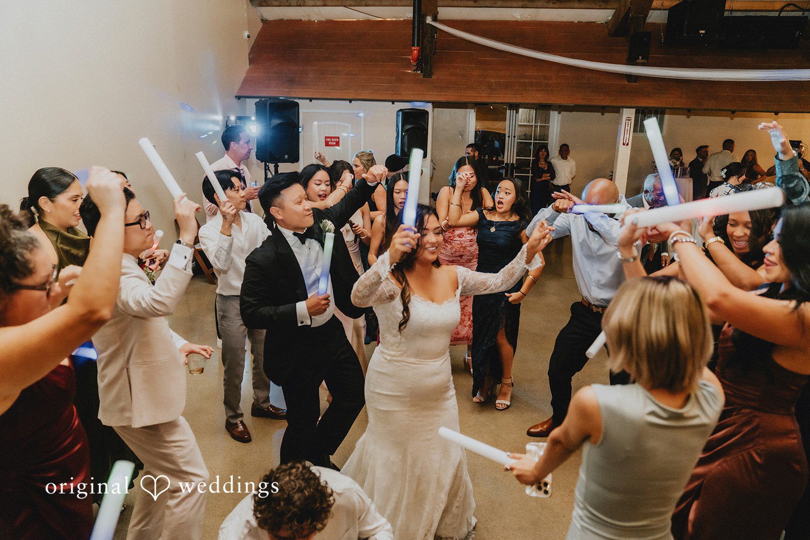 Sonia + Michael Guests dancing and celebrating at Church Ranch Event Center