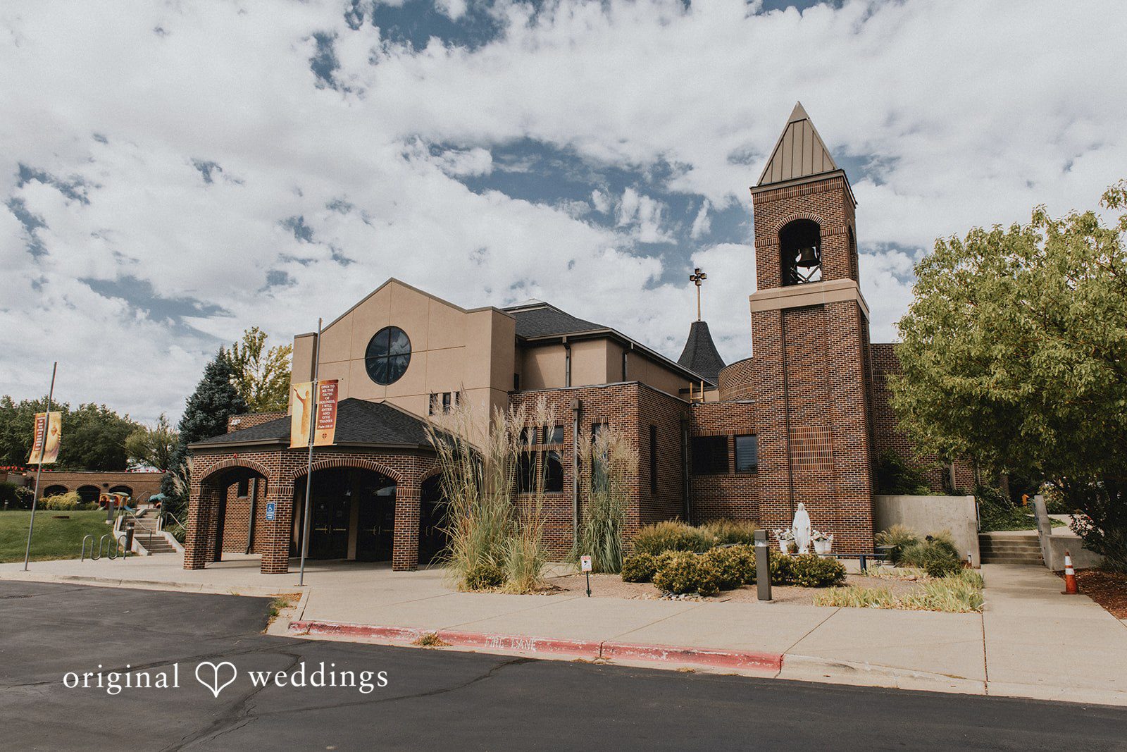 Sonia + Michael Church exterior with mountain views on Sonia and Michael's wedding day