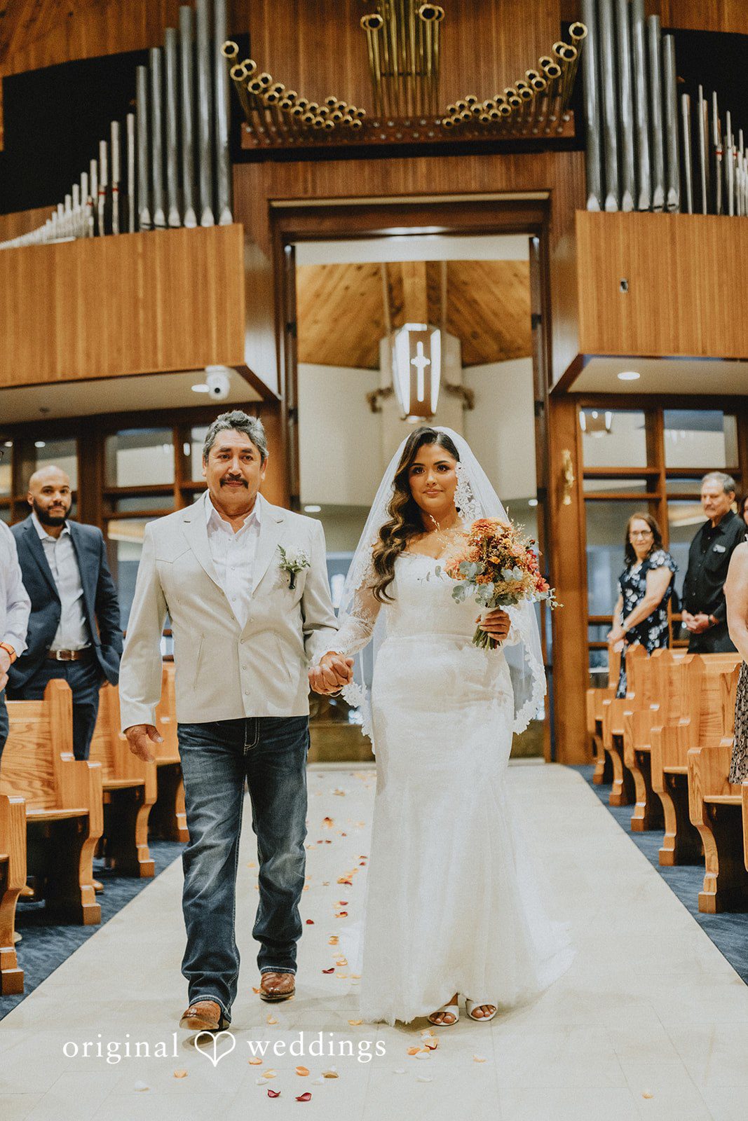 Sonia + Michael Bride walking down the church aisle with her father