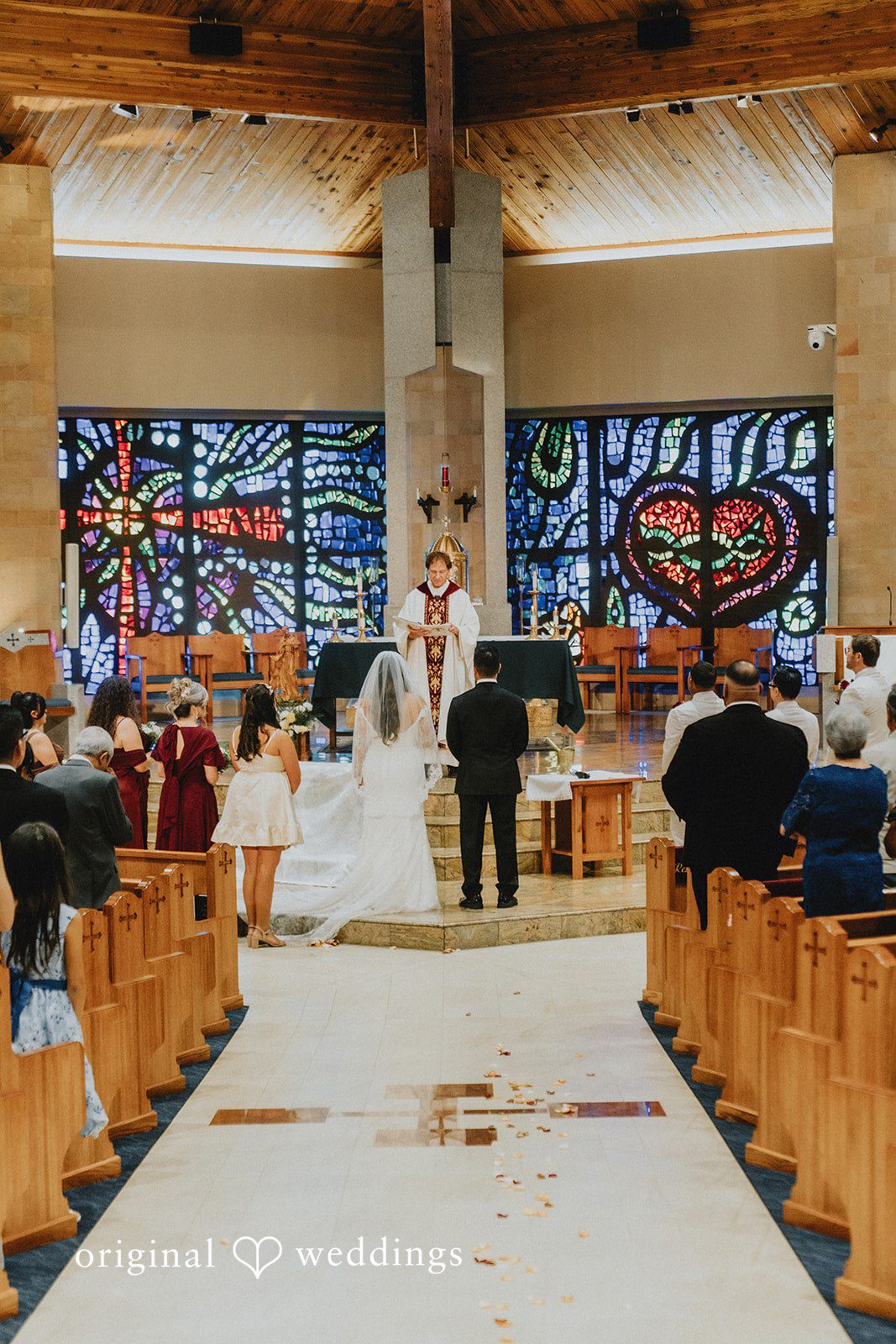Sonia + Michael Wide view of the Catholic ceremony from the church aisle