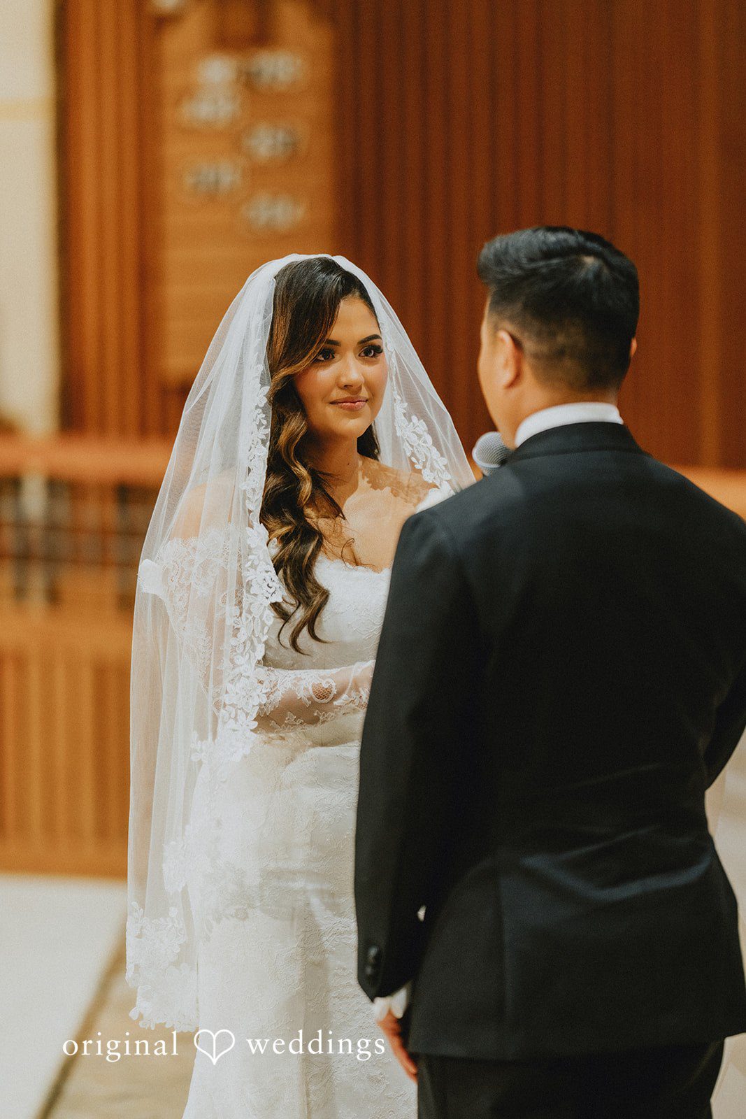 Sonia + Michael Bride and groom sharing a sweet moment at the altar
