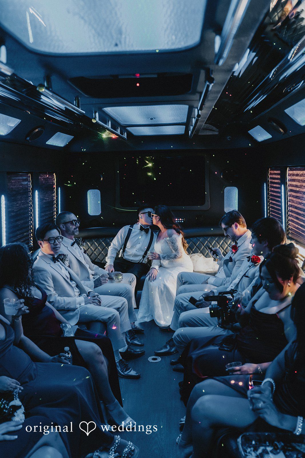 Sonia + Michael Wedding party celebrating inside the party bus