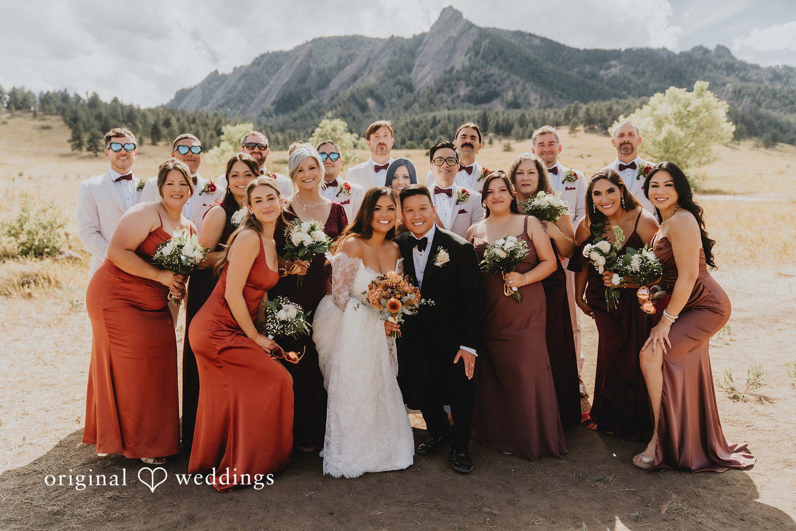 Sonia + Michael Full wedding party posing in the meadow near Church Ranch Event Center