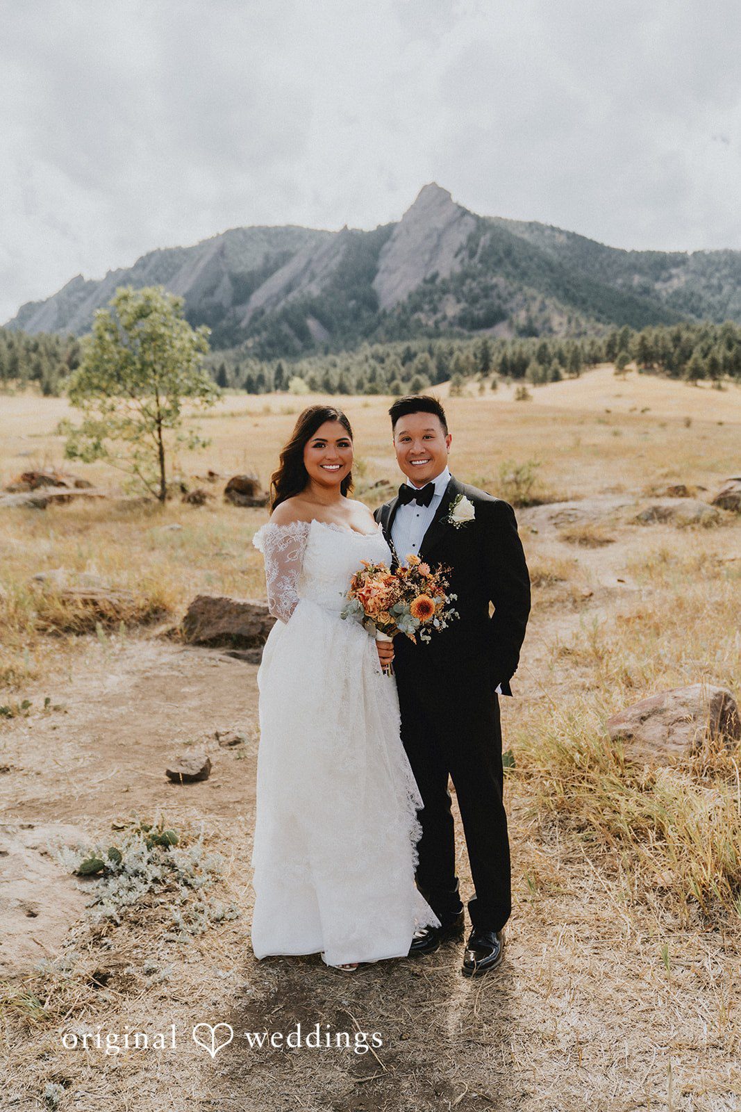 Sonia + Michael Bride and groom posing with mountain views for portraits