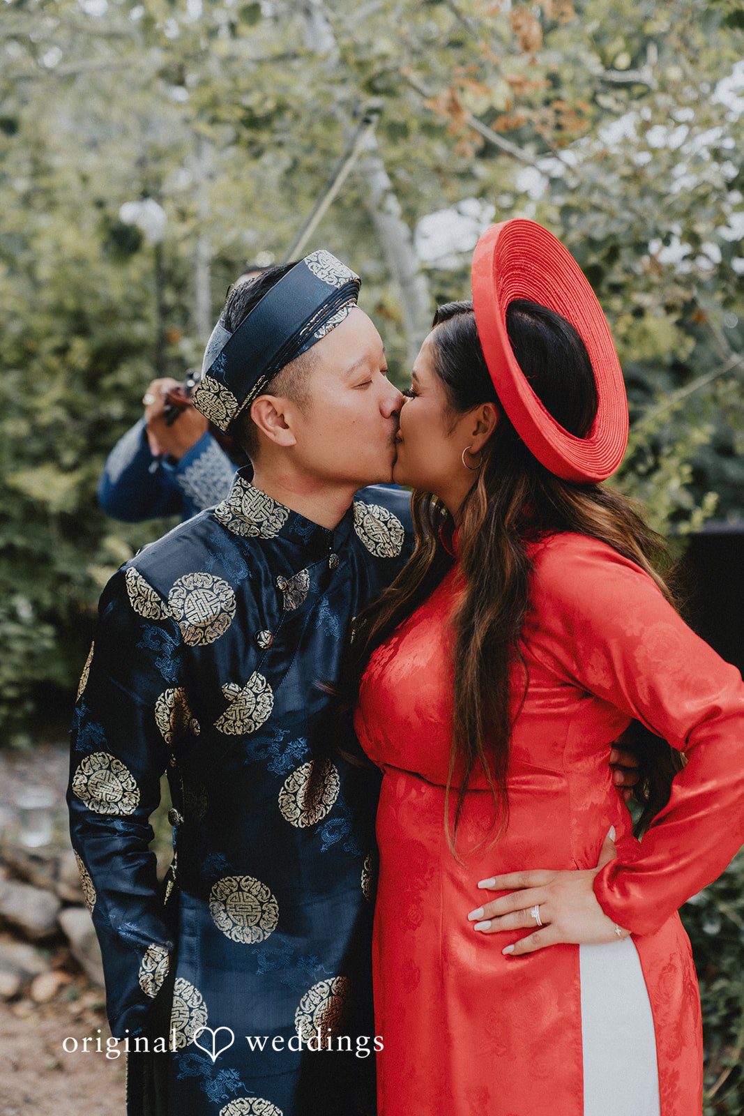 Sonia + Michael Couple kissing in traditional Vietnamese ao dai attire