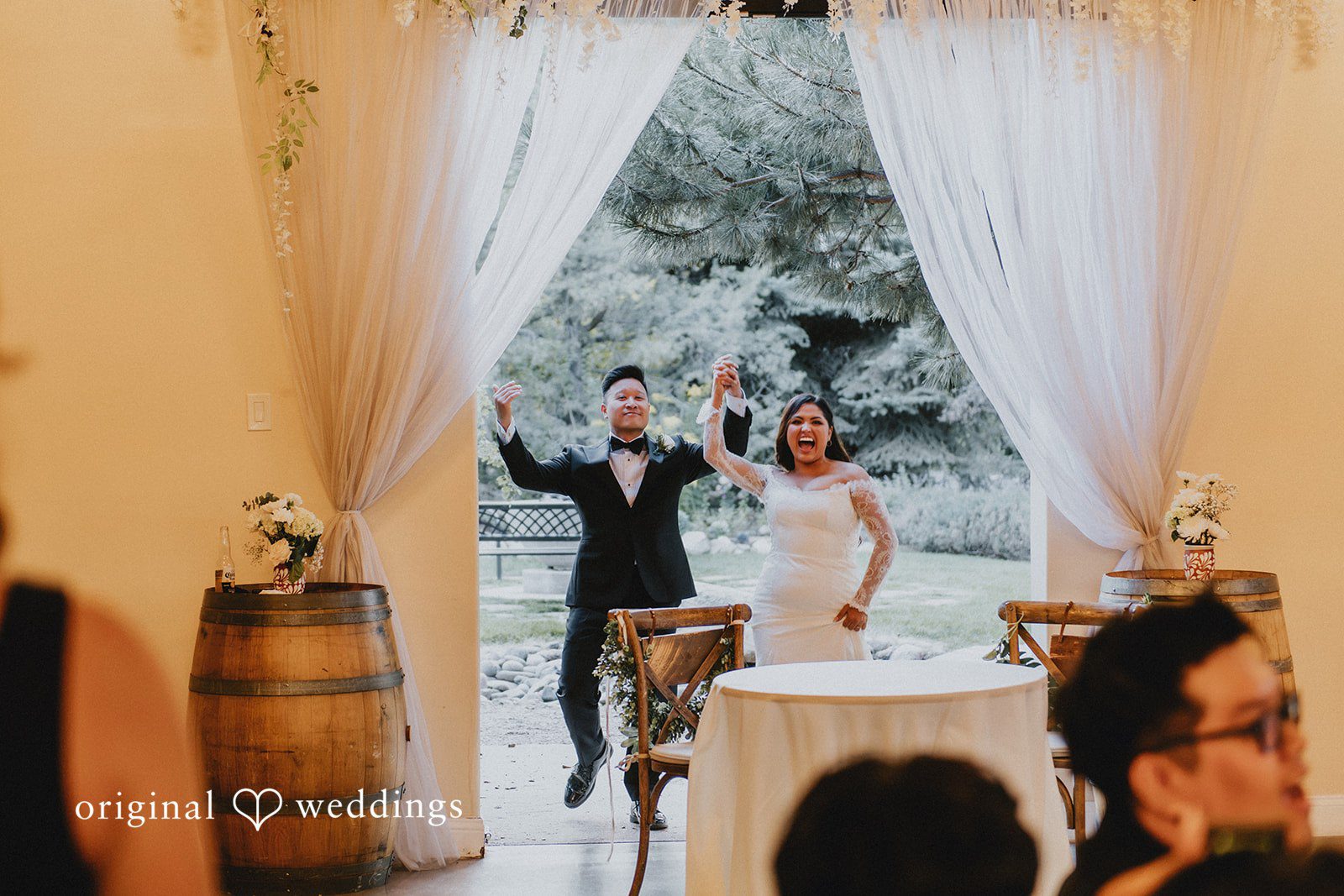 Sonia + Michael Bride and groom making their grand entrance at Church Ranch Event Center