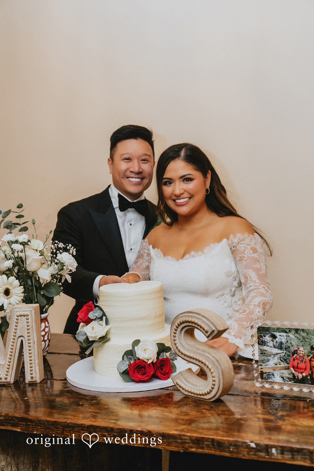 Sonia + Michael Newlyweds cutting the wedding cake at Church Ranch Event Center