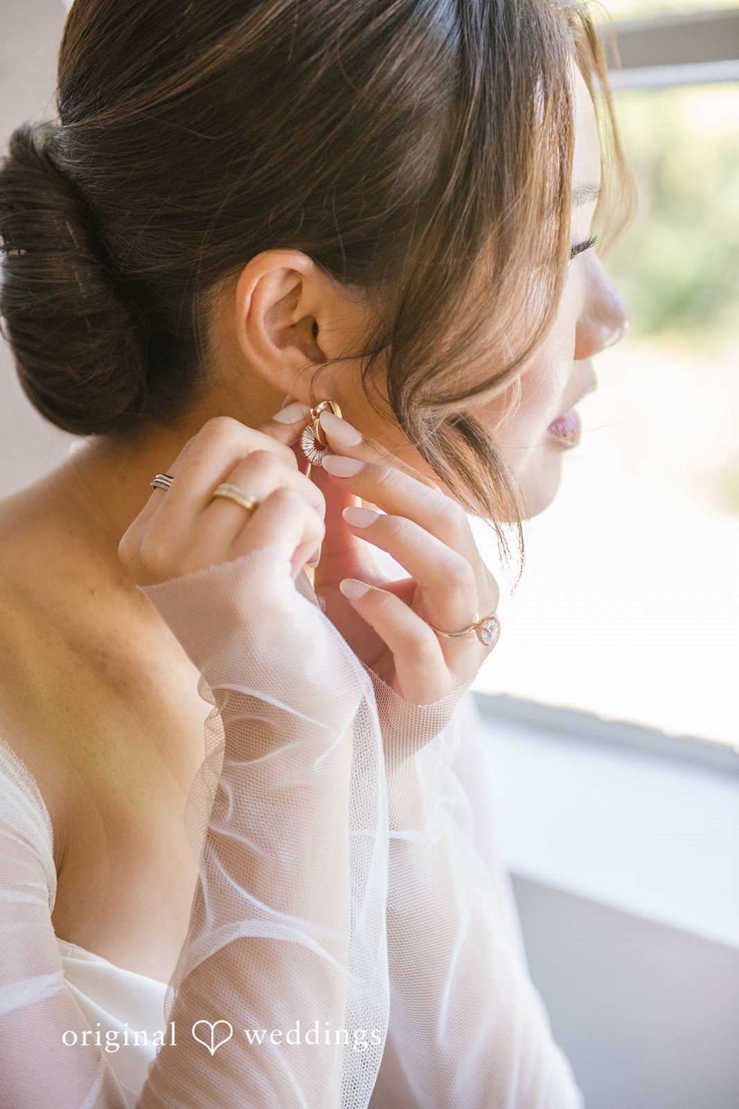 Yuri + Zachary Bride putting on her earrings