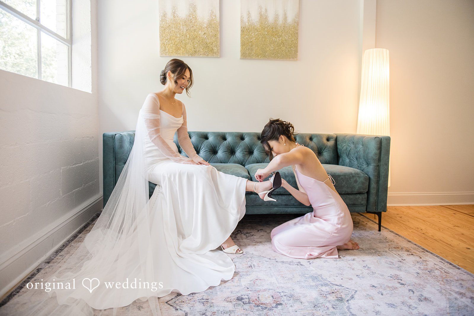 Yuri + Zachary Bride getting help with her gown