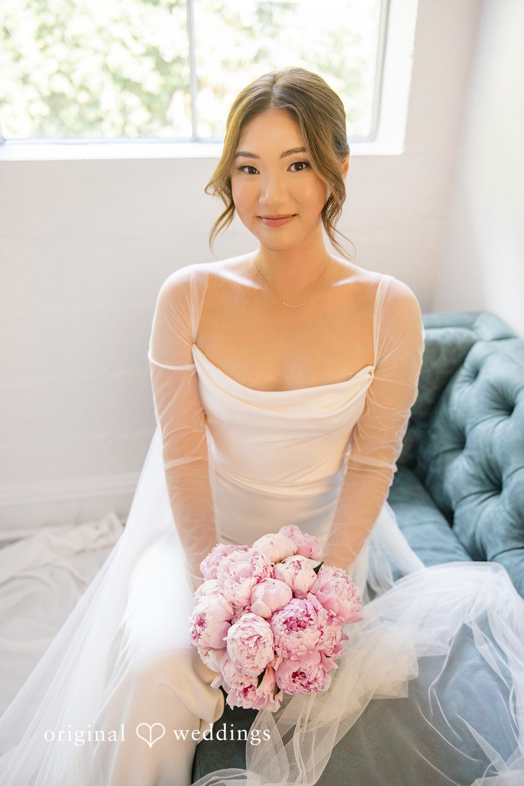 Yuri + Zachary Bride smiling with her pink bouquet