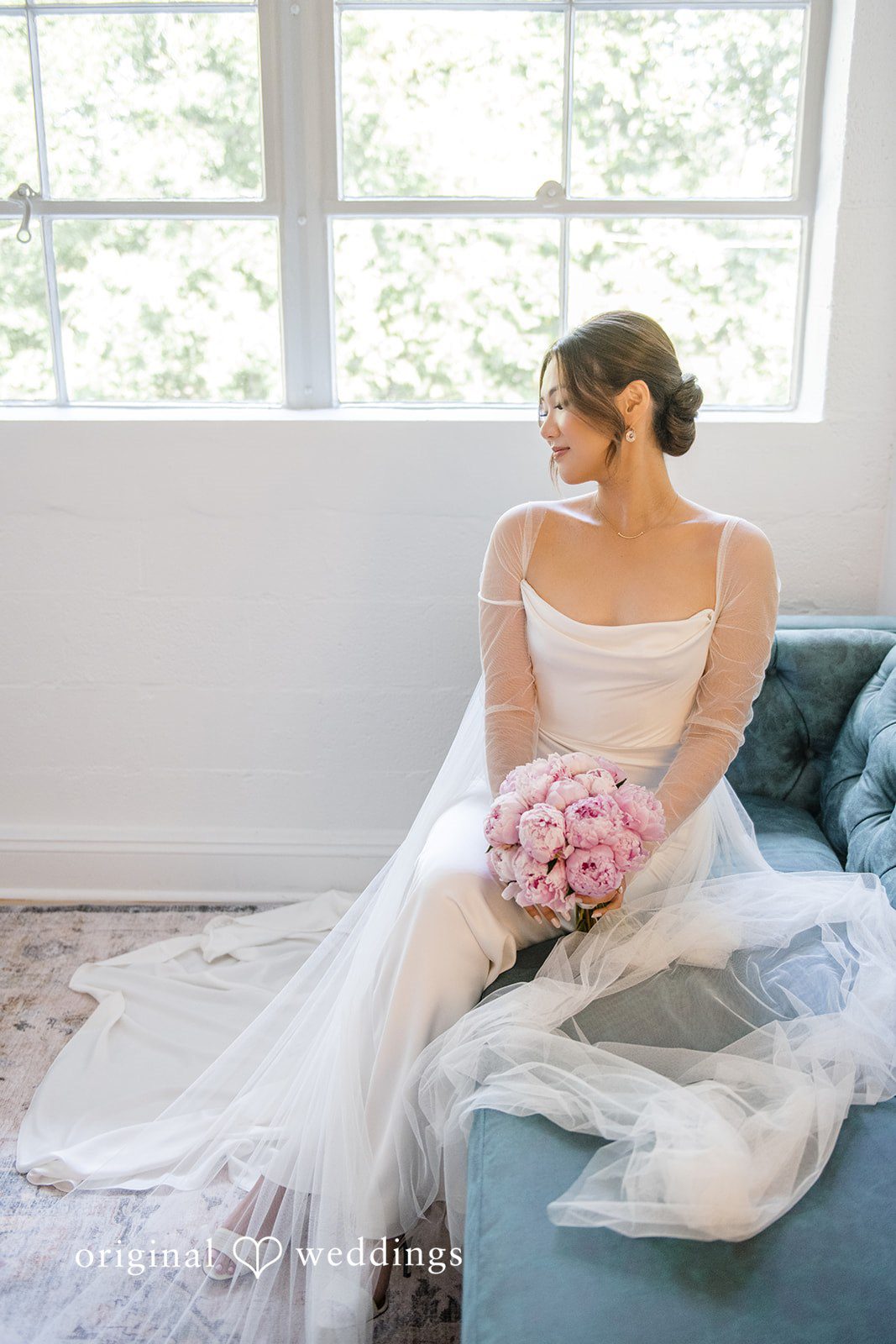 Yuri + Zachary Bride seated with her bouquet