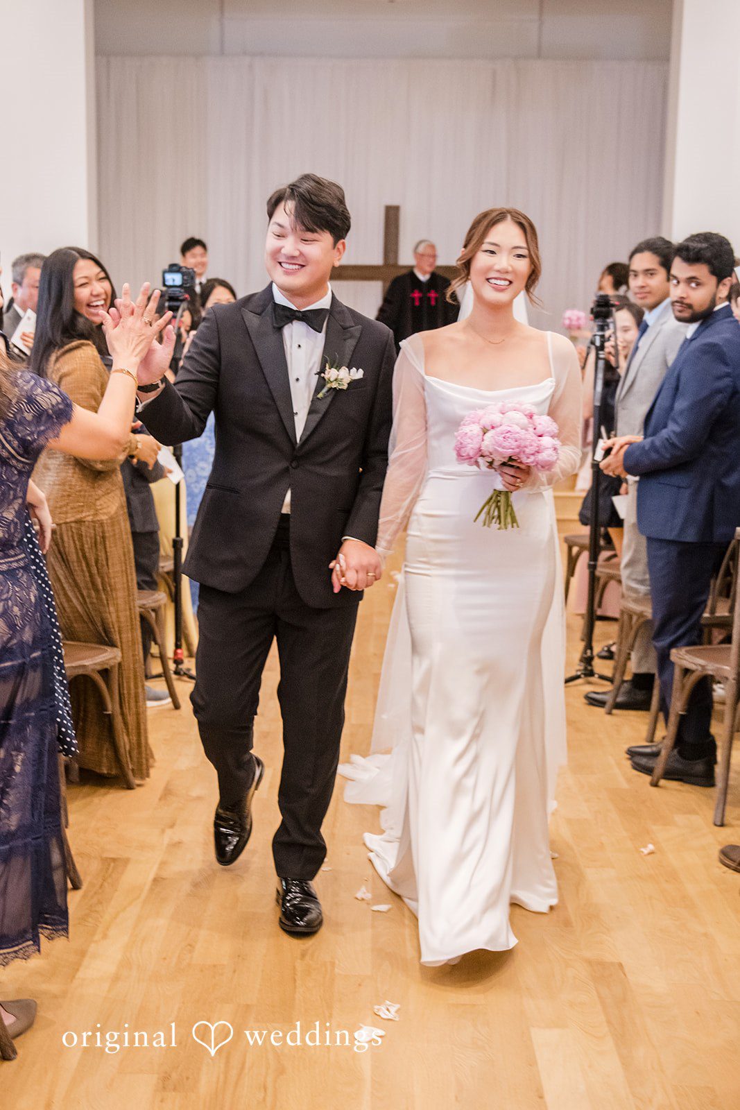 Yuri + Zachary Couple walking back up the aisle