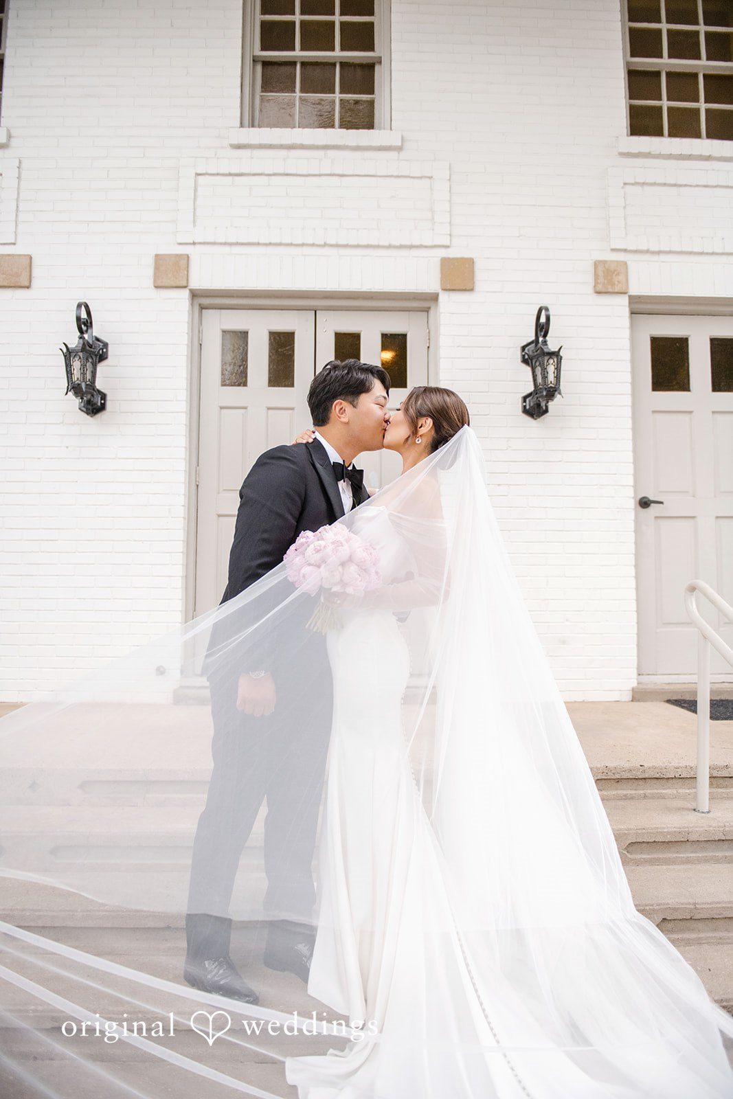 Yuri + Zachary Couple sharing a kiss