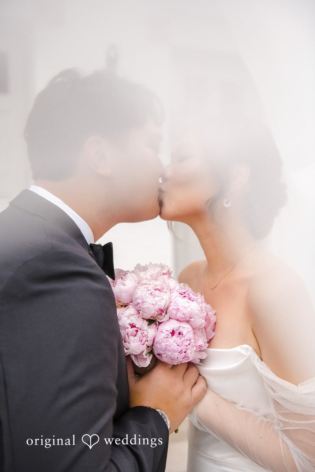 Yuri + Zachary Groom kissing the bride's hand