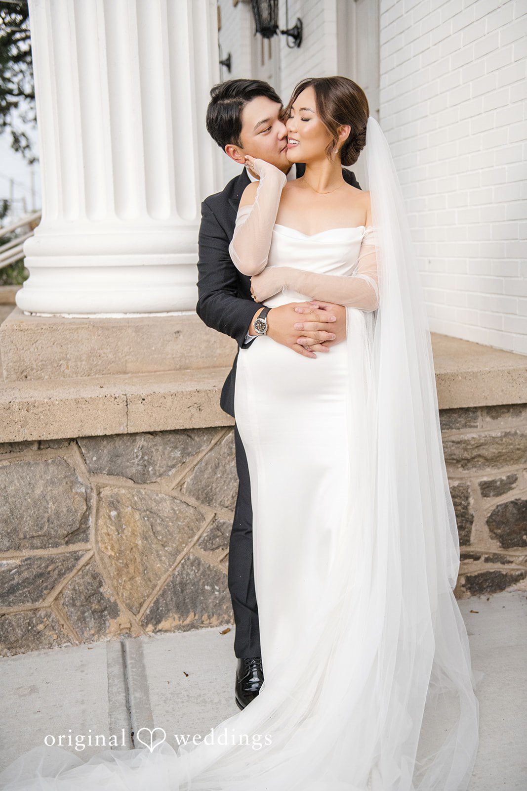 Yuri + Zachary Couple posing outside at Collier Hall