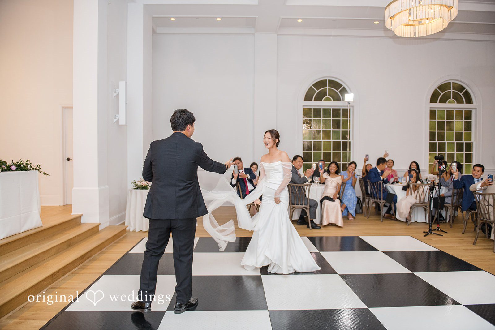 Yuri + Zachary Bride walking down the aisle on the checkered floor